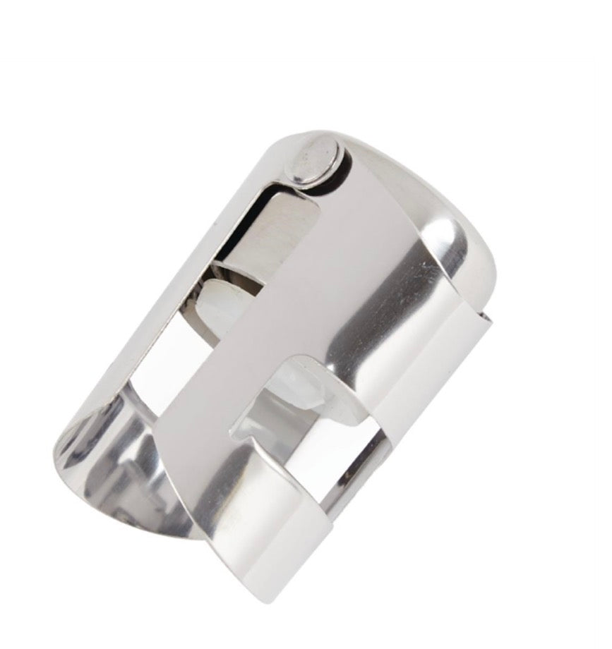 Silver champagne stopper made of stainless steel with a sleek, modern design, perfect for preserving Champagne bottles